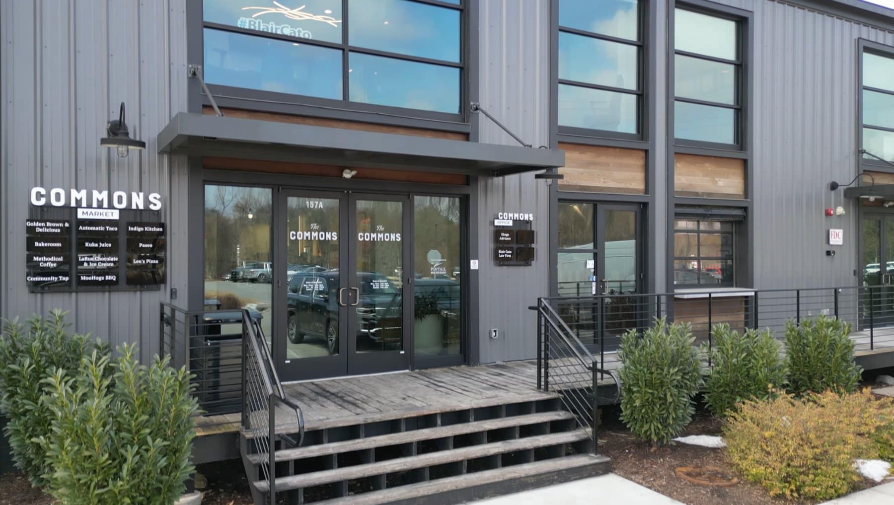 The Commons entrance &mdash; glass double doors beneath the #BlairCato sign